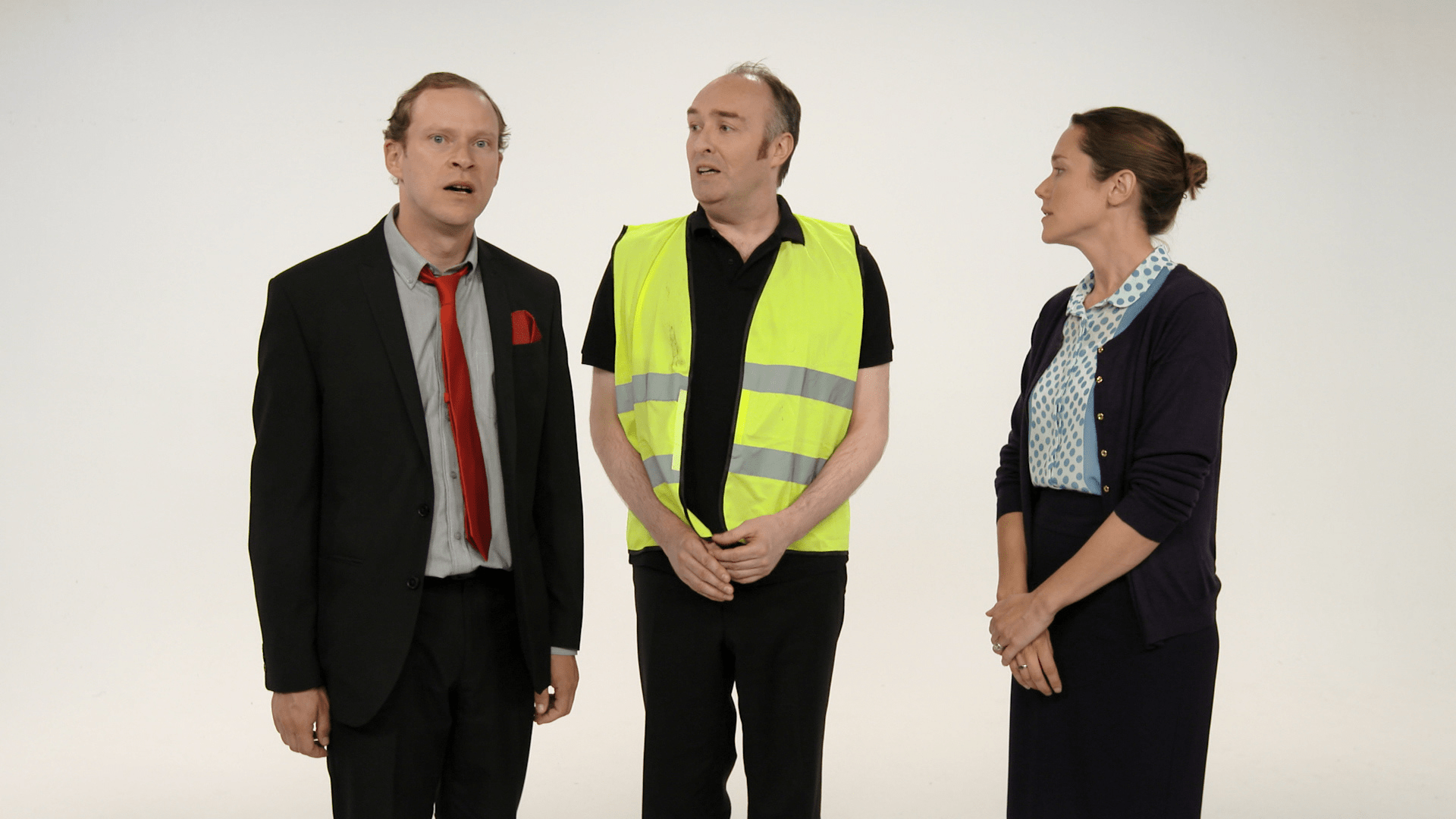 Robert Webb, A man in a high-vis and a woman stand in an empty room.