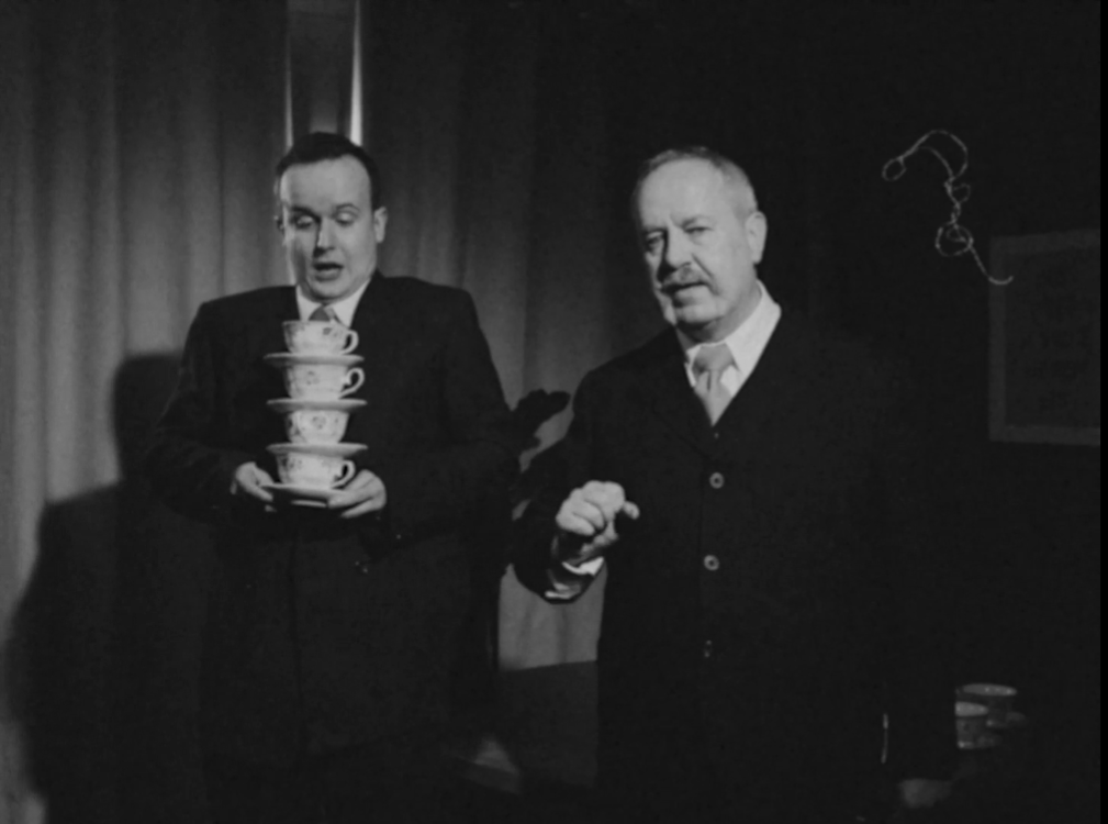A man holding a tower of teacups in 1930s styled picture film about how to upskill resilience