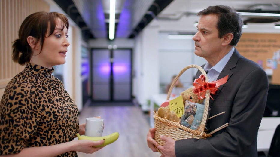 man holding basket talking to woman. L&D skills checklist.